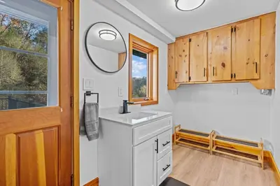 a bathroom with a sink and a mirror at Pine Hollow Lodge in Duncannon