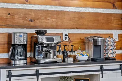 a counter with a coffee maker and a coffeemaker on it at Pine Hollow Lodge in Duncannon