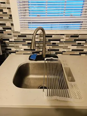 a sink with a faucet in a kitchen at Entire Spacious House in New Jersey in East Orange