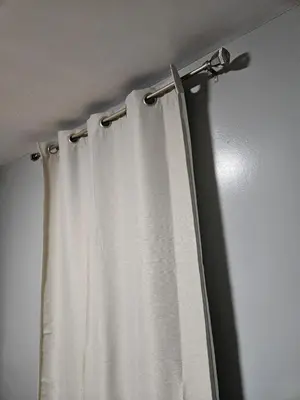 a curtain rod with a white curtain at Entire Spacious House in New Jersey in East Orange