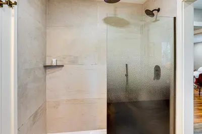 a shower with a glass door in a bathroom at Serene Getaway with Trail Access in Chester Springs in Chester Springs