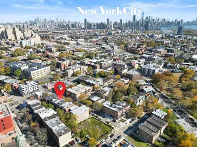 an aerial view of new york city with a red marker at Elegant Home w Patio | In-Unit Laundry Near NYC in Jersey City