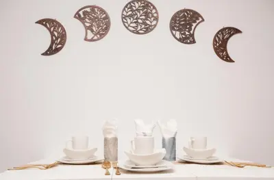 a table with plates and utensils and a heart made out of plates at West Village Escape - Steps from Subway Cafes in New York