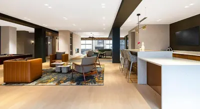 an open living room with a bar and a living room at express housing in Philadelphia