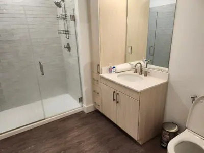 a bathroom with a sink and a shower at express housing in Philadelphia