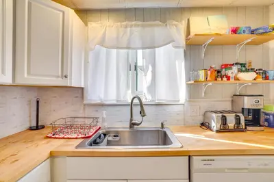 a kitchen with a sink and a window at All-Season Getaway on Lake Winola Dock and Sunroom! in Factoryville