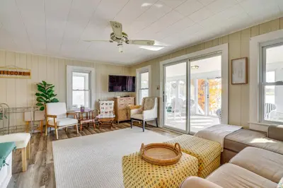 a living room with a couch and a table at All-Season Getaway on Lake Winola Dock and Sunroom! in Factoryville