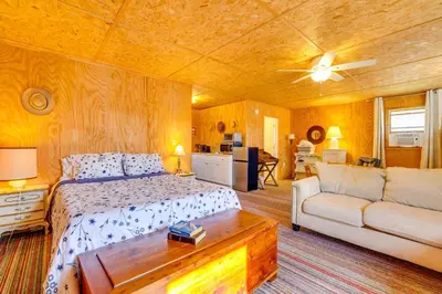 a bedroom with a bed and a couch and a table at Hike, Ski and Golf Water-View Lake Winola Retreat! in Factoryville