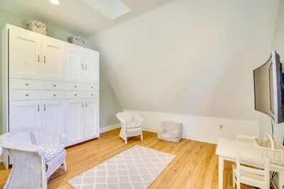 a room with white cabinets and a table and chairs at Scanton Area Retreat Drive to Montage and Elk Mtn! in Factoryville