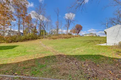 a large field with a house in the background at Scanton Area Retreat Drive to Montage and Elk Mtn! in Factoryville