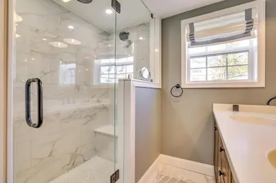a bathroom with a shower and a sink at Scenic Waterfront Home with Dock on Lake Winola! in Factoryville
