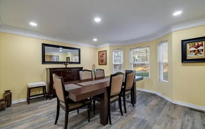 a dining room with a table and chairs at Lake Area 6BR Pet friendly home in Poconos - Your Pocono Retreat in Thornhurst