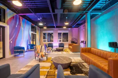 a lobby with a couch and chairs and a table at Smoked Amber Stay, Free Parking, Sleep 5, 20 percent OFF in East Orange