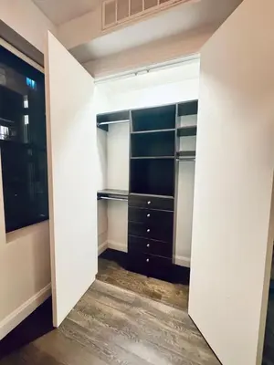 a walk in closet with black and white closets at Residence Heritage Terrace Dreaming in New York