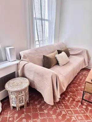 a bed sitting in a room with a window at Upper East Side 2Bed Dream in New York