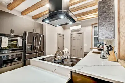 a kitchen with white counters and a stove top oven at Designer 5Bed - 4Bath Home in Old City A Plus Location in Philadelphia