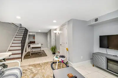 a living room with a fireplace and a tv at Outstanding Home Relaxing Rooftop with Patio & Grill in Philadelphia