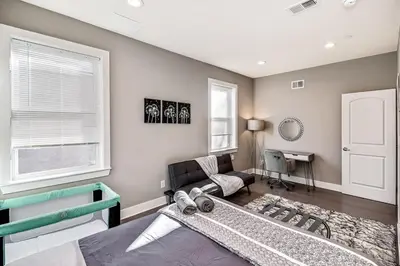 a living room with a couch and a table at Exceptional Downtown Townhome with Roof Deck -4Bedroom & 3Baths in Philadelphia