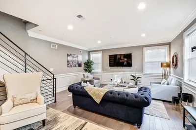 a living room with a couch and a tv at Exceptional Downtown Townhome with Roof Deck -4Bedroom & 3Baths in Philadelphia