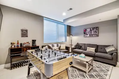 a living room with a large chess board in the middle of a living room at Exceptional Downtown Townhome with Roof Deck -4Bedroom & 3Baths in Philadelphia