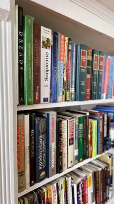 a book shelf filled with lots of books at Professional & Student-Friendly in Upper Darby
