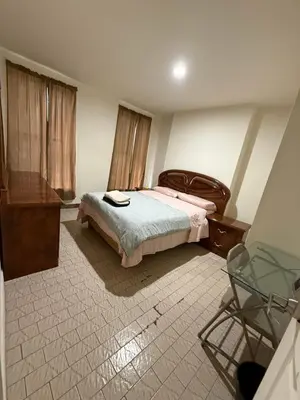 a bedroom with a bed and a tub in it at Hudson Yard 4 in New York