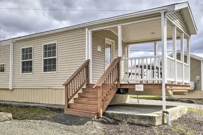 a house with a porch and a staircase on it at Country Escape near Camps & Ski in Pleasant Mount