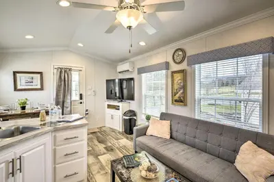 a living room with a couch and a kitchen at Premium Cottages and Suites near Ski Resort in Pleasant Mount