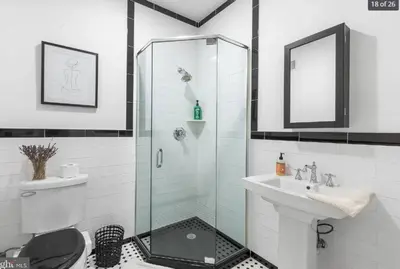 a bathroom with a shower and a toilet and a sink at Bright 2-Bed Loft in Northern Liberties Walk to Dining, Museums in Philadelphia