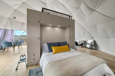 a bedroom with a large bed in a tent at Catskills Glamping at 'The Deer Dome' in Franklin in Franklin