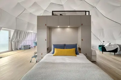 a bedroom with a bed in a tent at Catskills Glamping at 'The Deer Dome' in Franklin in Franklin