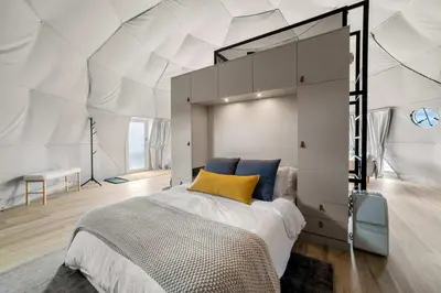 a bedroom with a large bed in a tent at Catskills Glamping at 'The Deer Dome' in Franklin in Franklin