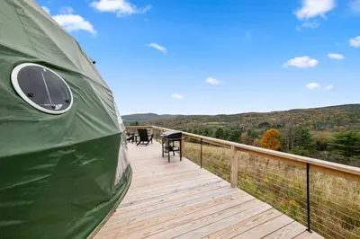 a deck with a tent on top of a building at Catskills Glamping at 'The Deer Dome' in Franklin in Franklin
