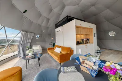 a living room in a dome house with a view at Catskills Glamping at 'The Deer Dome' in Franklin in Franklin