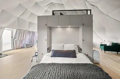a bedroom with a large bed in a tent at Glamping Getaway at 'The Coyote Dome' in Franklin in Franklin