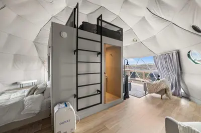 a bedroom with a bed in a tent at Barrel Hot Tub at 'The Eagle Dome' in Franklin in Franklin