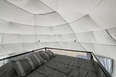 a ceiling of a building with a bed in it at Barrel Hot Tub at 'The Eagle Dome' in Franklin in Franklin
