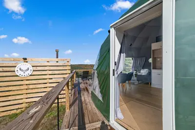 a view from the deck of a tiny house at Barrel Hot Tub at 'The Eagle Dome' in Franklin in Franklin