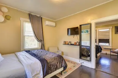 a bedroom with a bed and a mirror at Easy Commute to Newark and NYC! Extended Stay Unit in Irvington
