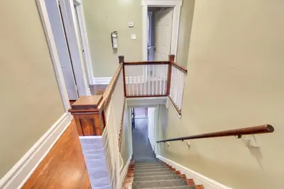 a hallway with stairs and a stair case at Free Parking Spot! Extended Stay Near Newark and NYC in Irvington