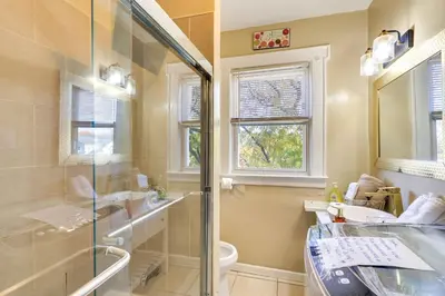a bathroom with a shower and a sink and a toilet at Free Parking Spot! Extended Stay Near Newark and NYC in Irvington