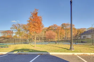 a park with two tennis courts and a fence at Free Parking Spot! Extended Stay Near Newark and NYC in Irvington