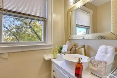 a bathroom with a sink and a mirror at Free Parking Spot! Extended Stay Near Newark and NYC in Irvington