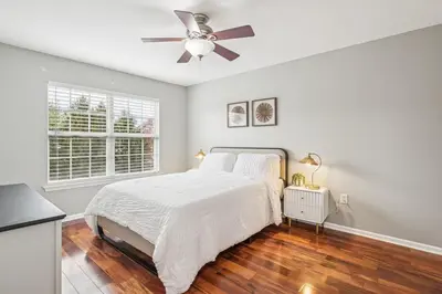 a bedroom with a bed and a ceiling fan at Spacious 3BR Near Rutgers plus Princeton plus NYC Access in Franklin Park
