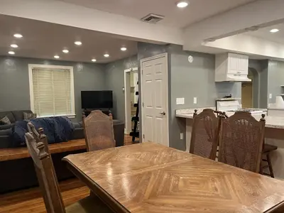 a kitchen and living room with a table and chairs at Inviting, Calming PR -Lourdes Hospital Binghamton in Johnson City