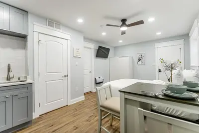 a kitchen and living room with a bed and a table at Studio Minutes from Center City South Philly Special in Philadelphia