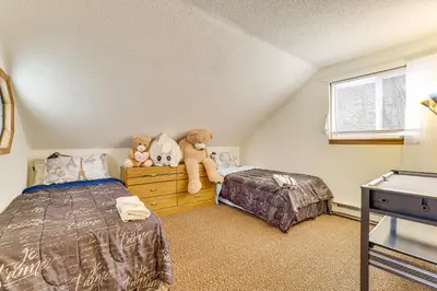 a bedroom with two beds and teddy bears on a dresser at Ski, Swim and Hike! Family Home in Tobyhanna in Tobyhanna