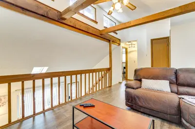 a living room with a couch and a table at Ski, Swim and Hike! Family Home in Tobyhanna in Tobyhanna