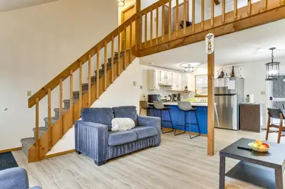 a living room with a couch and a table at Ski, Swim and Hike! Family Home in Tobyhanna in Tobyhanna