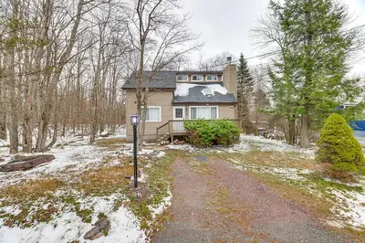 a house in the snow with a road in front of it at Ski, Swim and Hike! Family Home in Tobyhanna in Tobyhanna